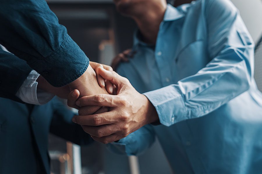 About Our Agency - Two Businessmen Shaking Hands in the Office